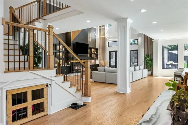 a view of entryway livingroom and hall with wooden floor