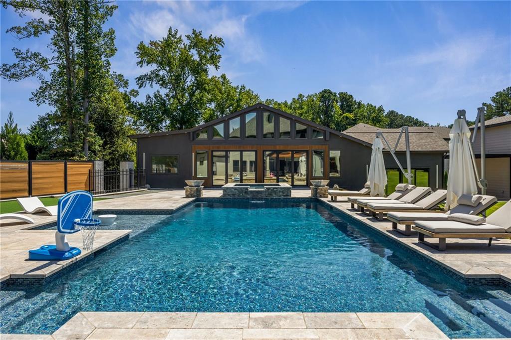 2641 Camp Branch Road Buford, GA 30519 - Photo 41 of 44 a view of a house with backyard patio and swimming pool