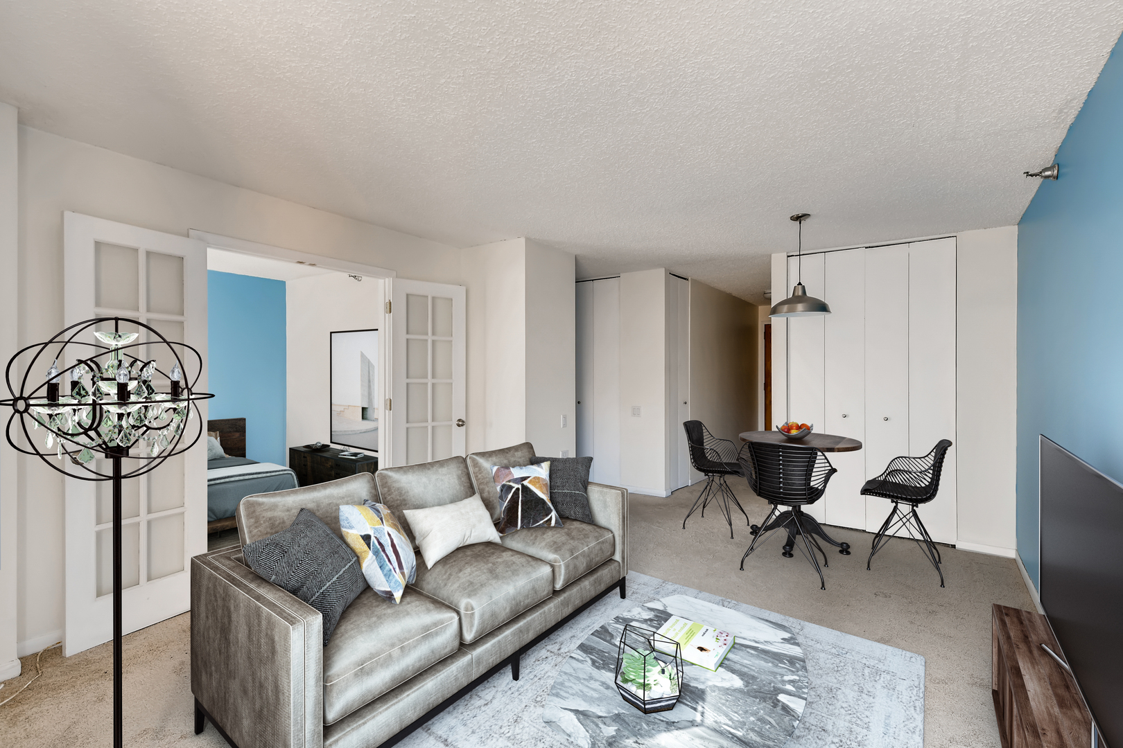 1122 North Clark Street, Unit 2209 Chicago, IL 60610 - Photo 3 of 11 a living room with furniture a couch and a chandelier