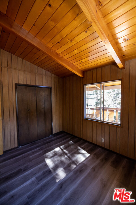 5212 Lone Pine Canyon Road Wrightwood, CA 92397 - Photo 11 of 42 an empty room with wooden floor and windows