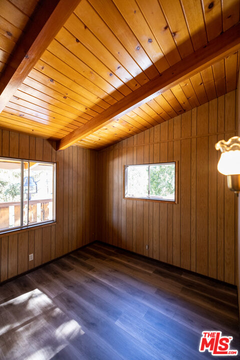 5212 Lone Pine Canyon Road Wrightwood, CA 92397 - Photo 13 of 42 an empty room with wooden floor and windows