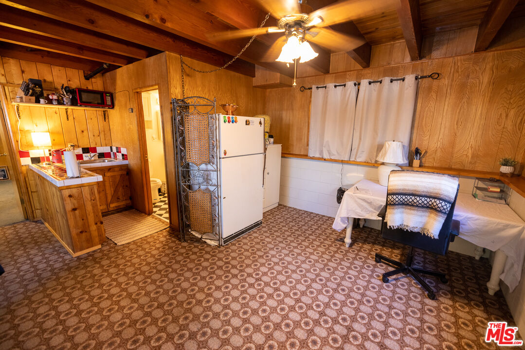 5212 Lone Pine Canyon Road Wrightwood, CA 92397 - Photo 19 of 42 a room with chairs and window