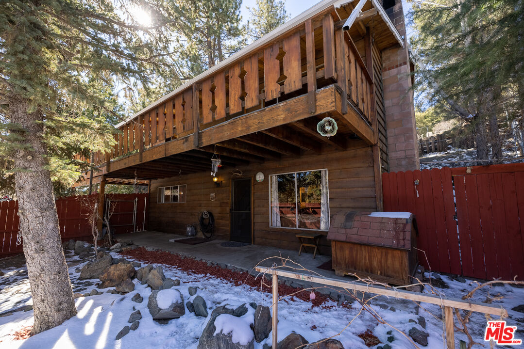 5212 Lone Pine Canyon Road Wrightwood, CA 92397 - Photo 2 of 42 a view of a chair and tables in the balcony