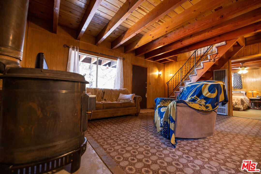 5212 Lone Pine Canyon Road Wrightwood, CA 92397 - Photo 21 of 42 a living room with a couch and a table
