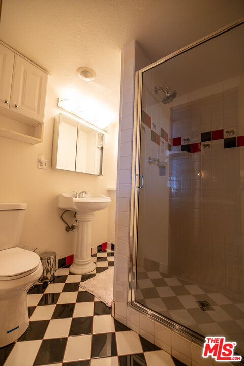 5212 Lone Pine Canyon Road Wrightwood, CA 92397 - Photo 24 of 42 a bathroom with a toilet and a shower