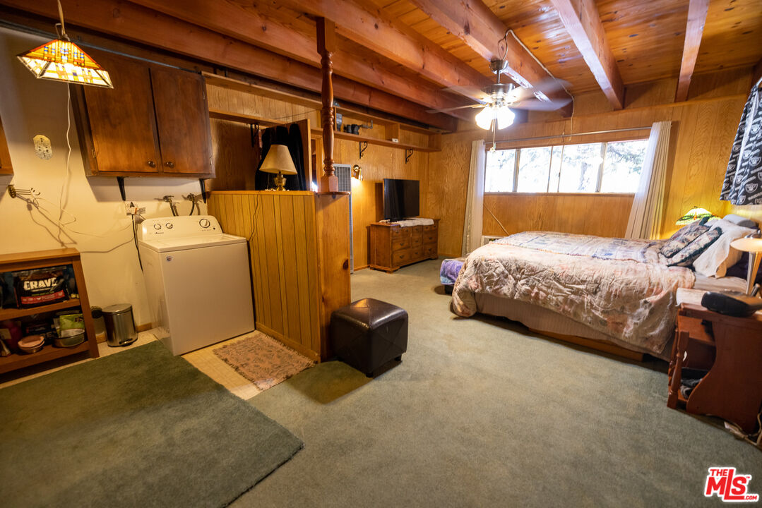 5212 Lone Pine Canyon Road Wrightwood, CA 92397 - Photo 28 of 42 a bedroom with bed and window