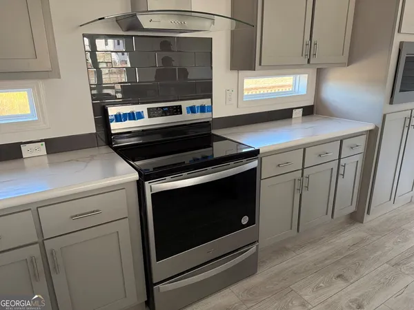 a kitchen with a sink and a window