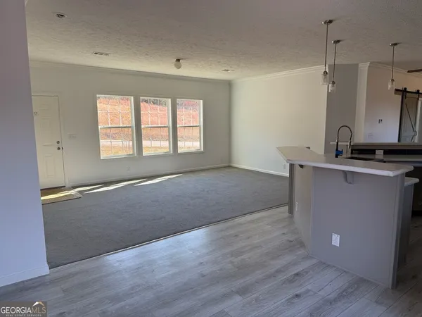 a view of a kitchen with a sink and dishwasher