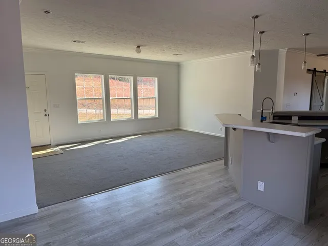 a view of a kitchen with a sink and dishwasher