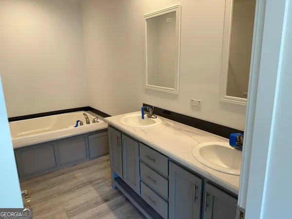 a bathroom with a sink and a bathtub