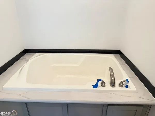 a bathroom with a shower and toilet