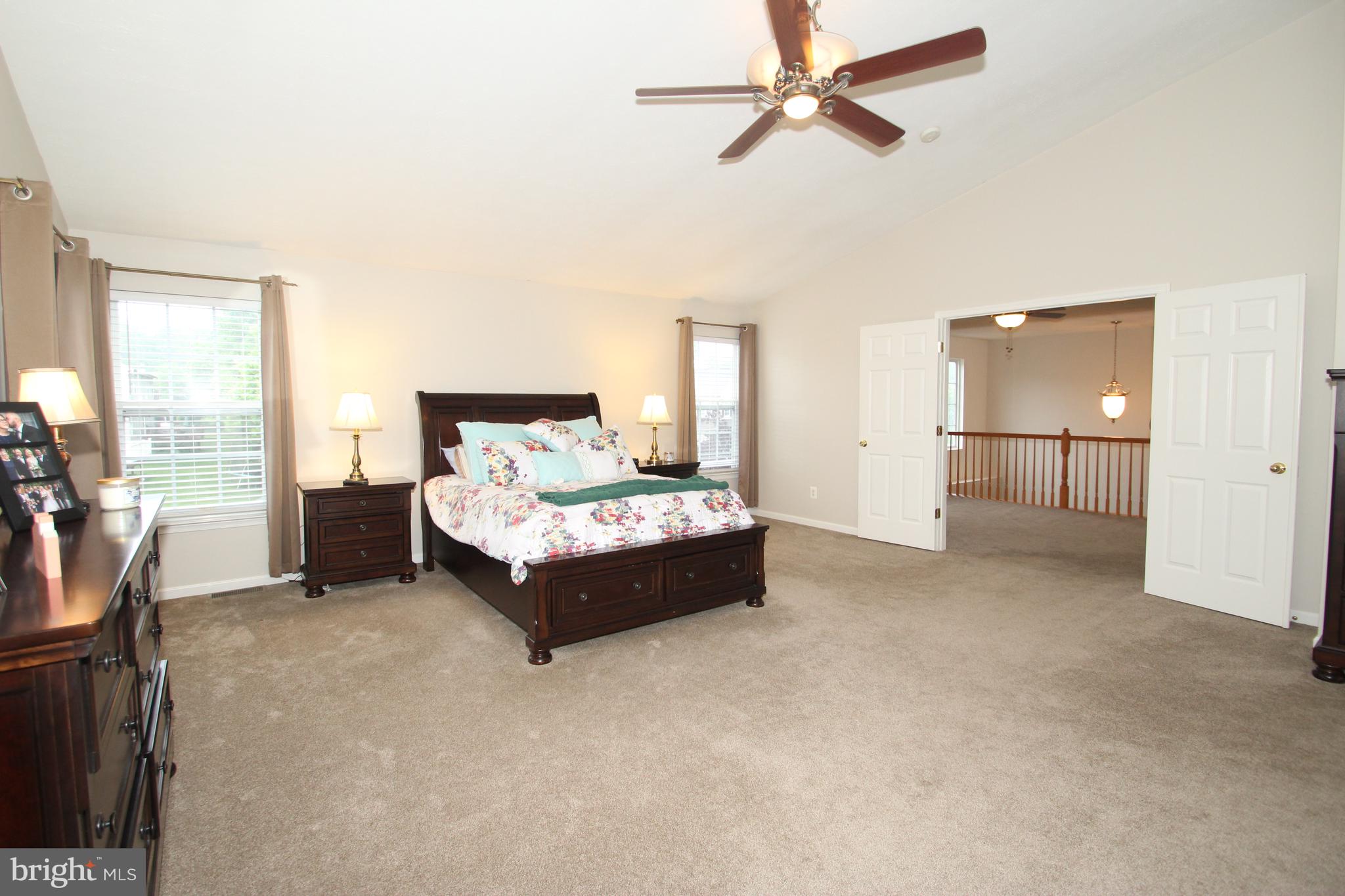 102 Patton Way Elkton, MD 21921 - Photo 14 of 27 a spacious bedroom with a bed and cabinet