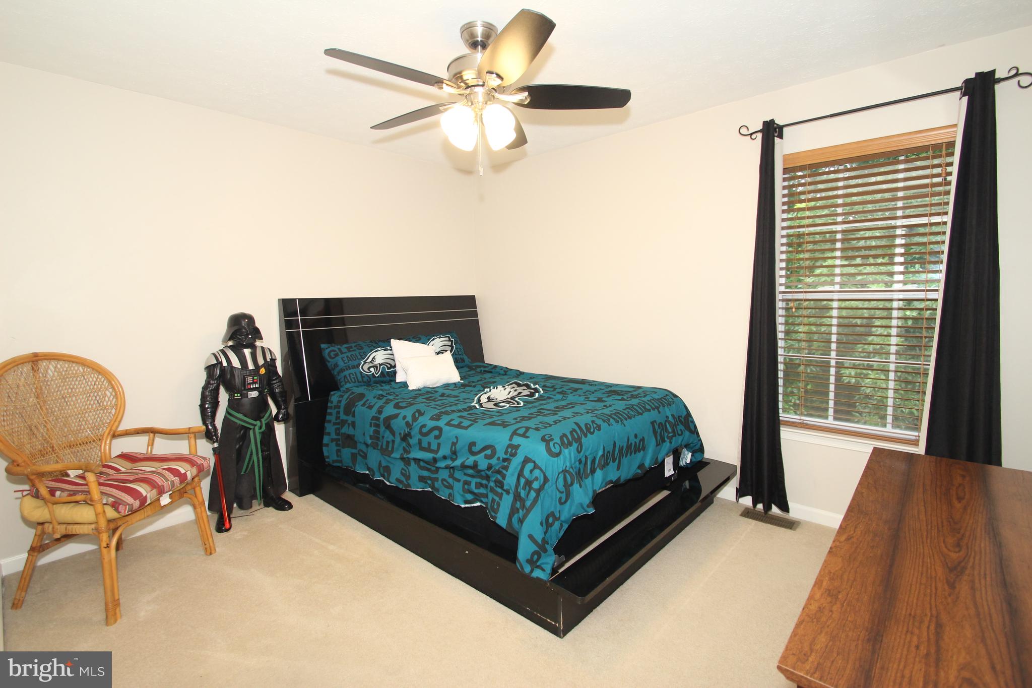 102 Patton Way Elkton, MD 21921 - Photo 17 of 27 a bed sitting in a bedroom next to a window