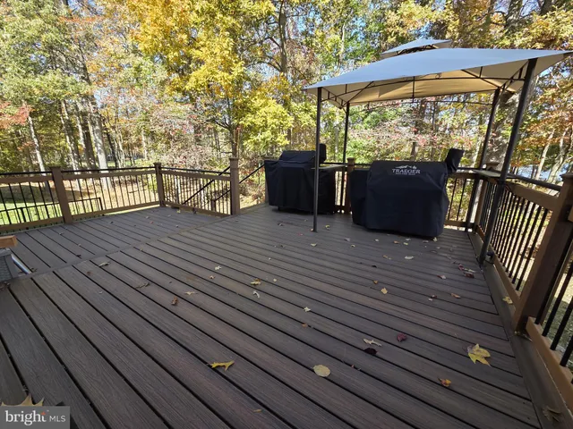 a view of a balcony with wooden floor