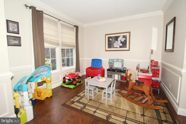 a living room filled with furniture and flowers