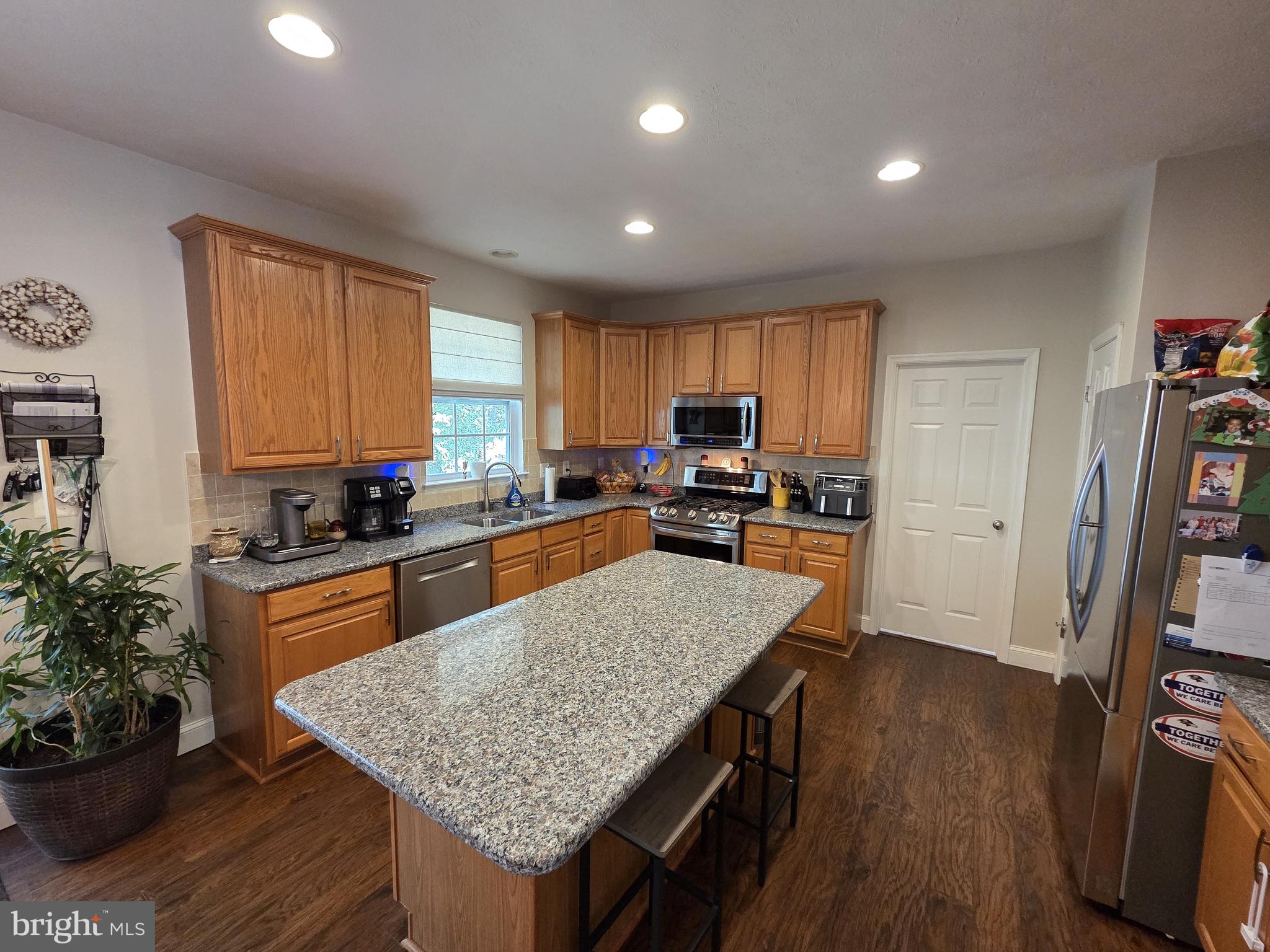102 Patton Way Elkton, MD 21921 - Photo 6 of 27 a kitchen with granite countertop lots of counter top space and wooden floor