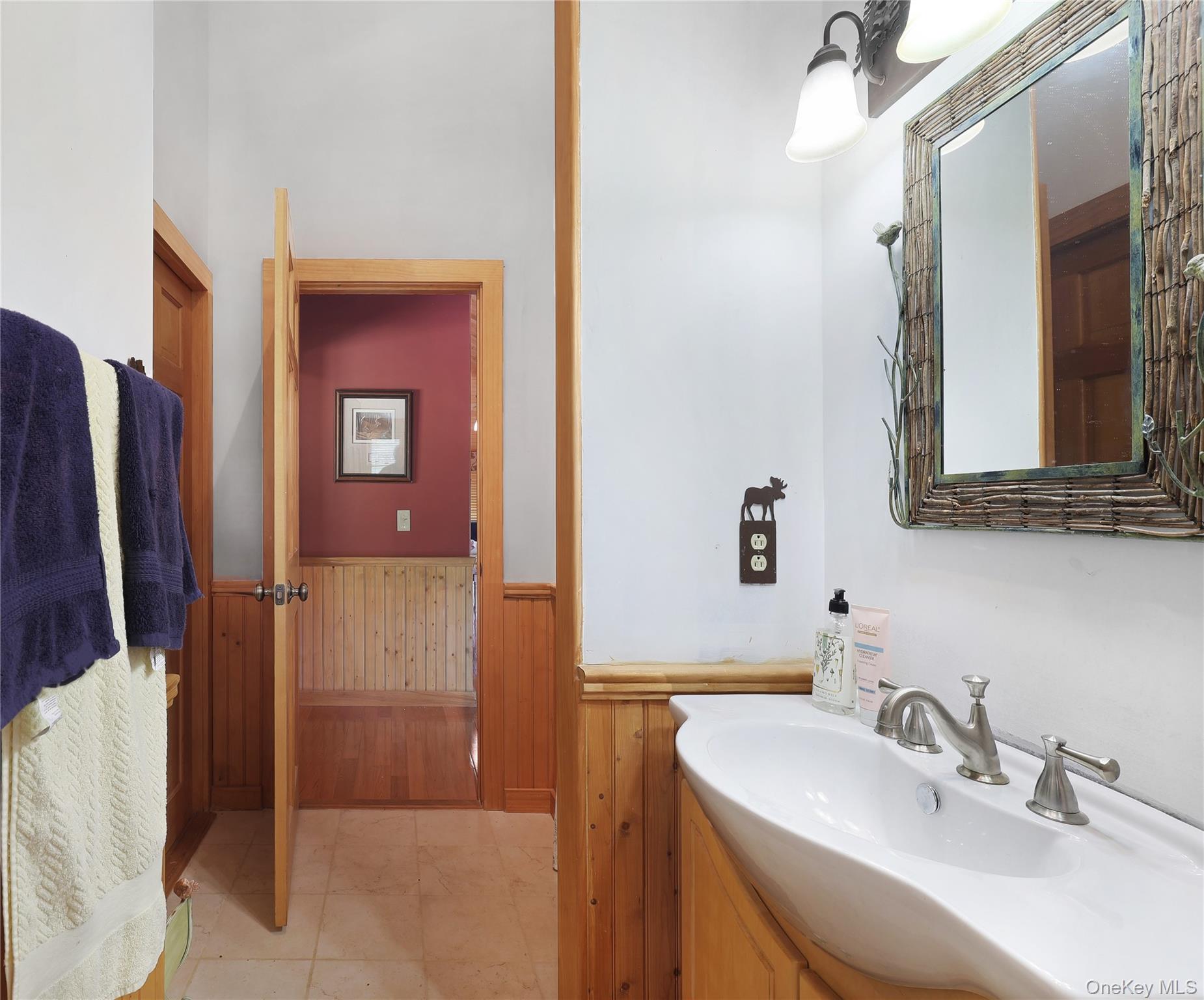 25 Cauthers Road Fallsburg, NY 12789 - Photo 26 of 27 a bathroom with a sink and mirror