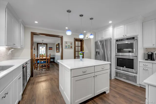 a kitchen with a sink and refrigerator