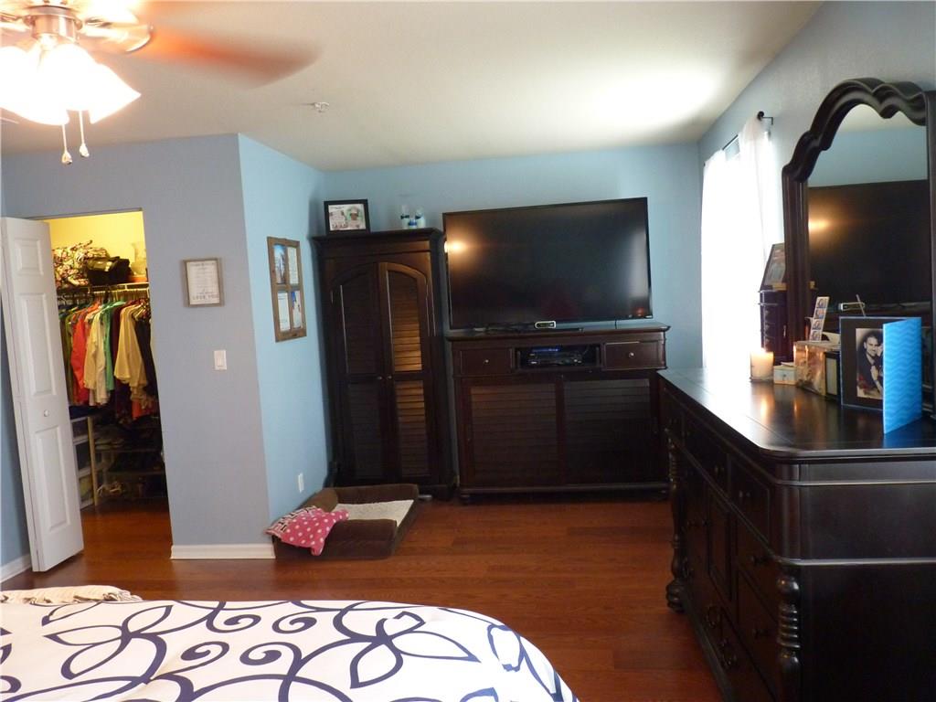 5298 Southeast Mitchell Lane Stuart, FL 34997 - Photo 13 of 33 a bedroom with a bed and a television