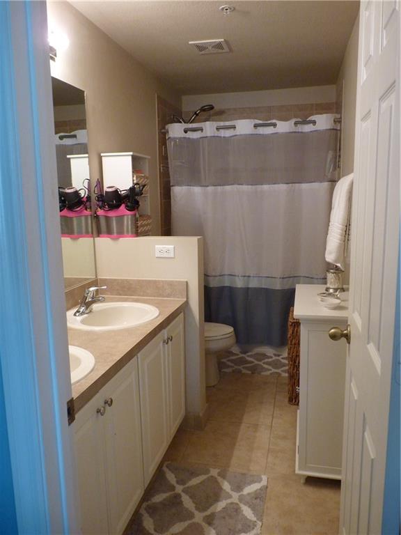 5298 Southeast Mitchell Lane Stuart, FL 34997 - Photo 14 of 33 a bathroom with a sink toilet and shower