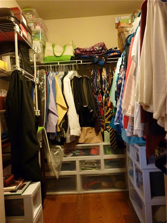 5298 Southeast Mitchell Lane Stuart, FL 34997 - Photo 16 of 33 a view of walk in closet with clothes
