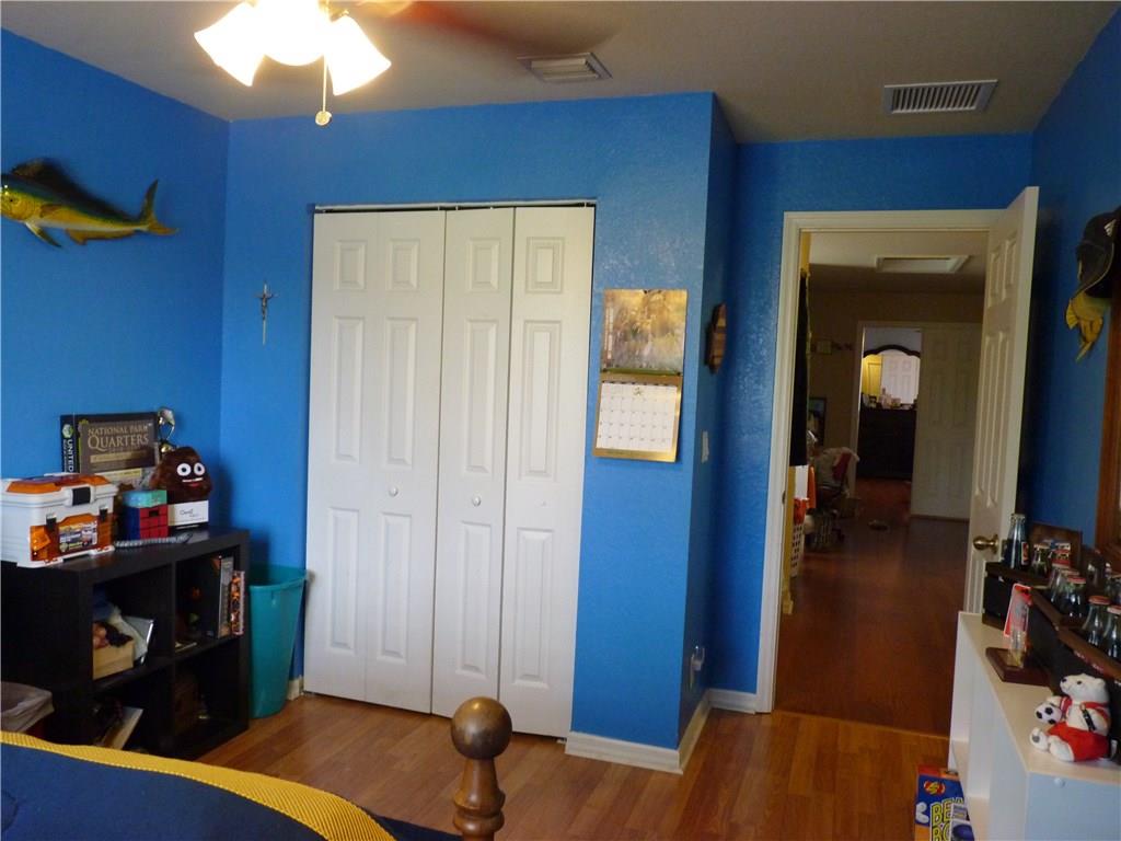 5298 Southeast Mitchell Lane Stuart, FL 34997 - Photo 18 of 33 a view of a workspace with furniture and wooden floor