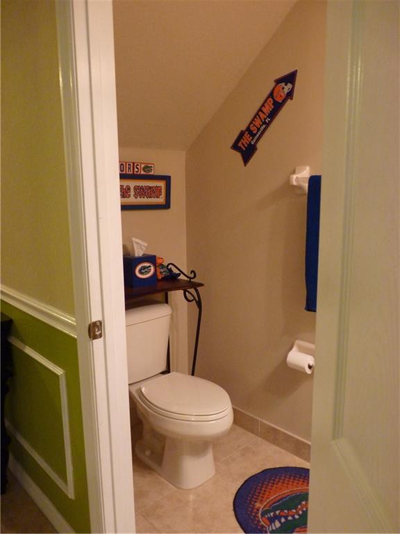 5298 Southeast Mitchell Lane Stuart, FL 34997 - Photo 24 of 33 a bathroom with a toilet and a shower