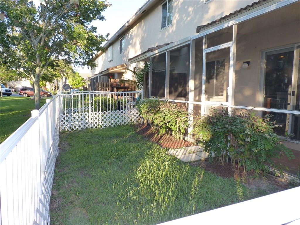 5298 Southeast Mitchell Lane Stuart, FL 34997 - Photo 28 of 33 a view of a house with a yard