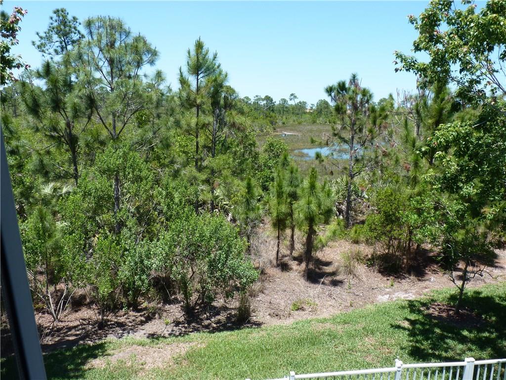 5298 Southeast Mitchell Lane Stuart, FL 34997 - Photo 31 of 33 a view of a garden with trees