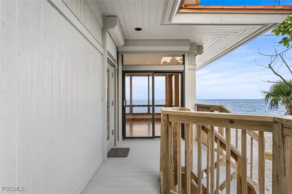 a view of a balcony with furniture