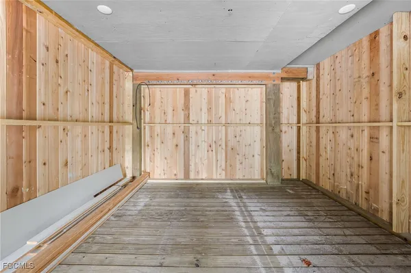 a view of an entryway with wooden floor