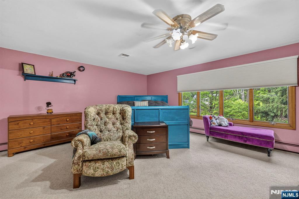 5110 Berkshire Valley Road Oak Ridge, NJ 07438 - Photo 22 of 49 a living room with furniture and a large window