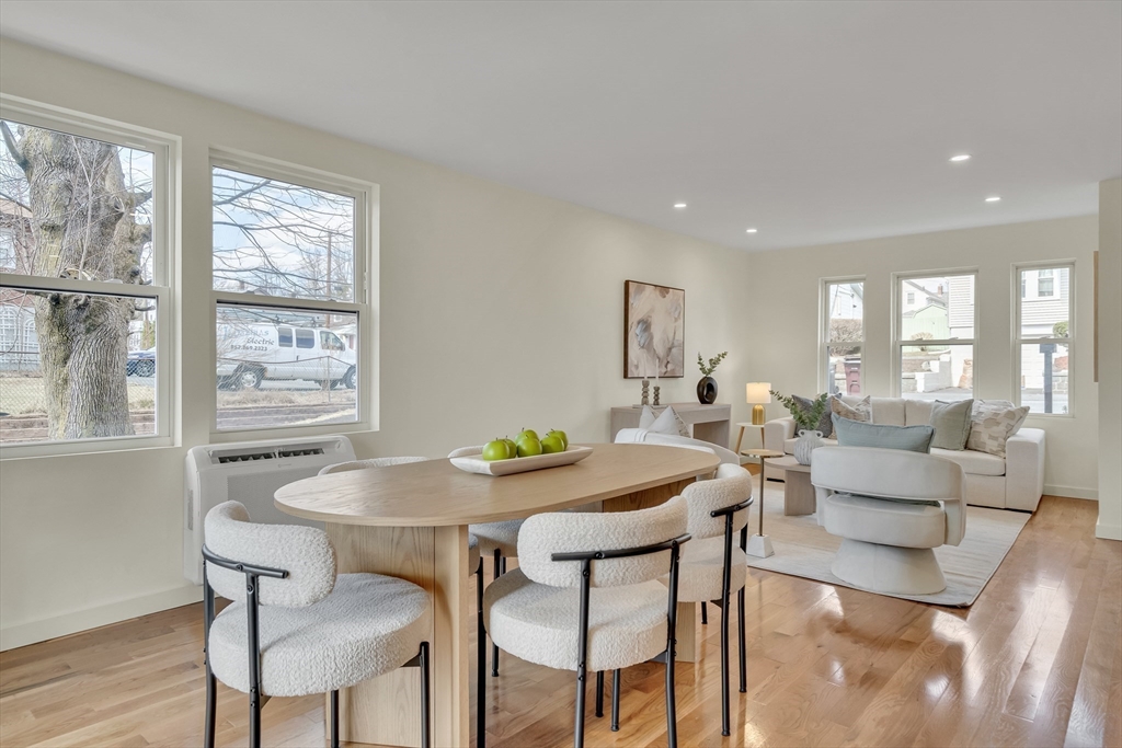 56 Riverview Street Dedham, MA 02026 - Photo 4 of 29 a view of a dining room with furniture and wooden floor
