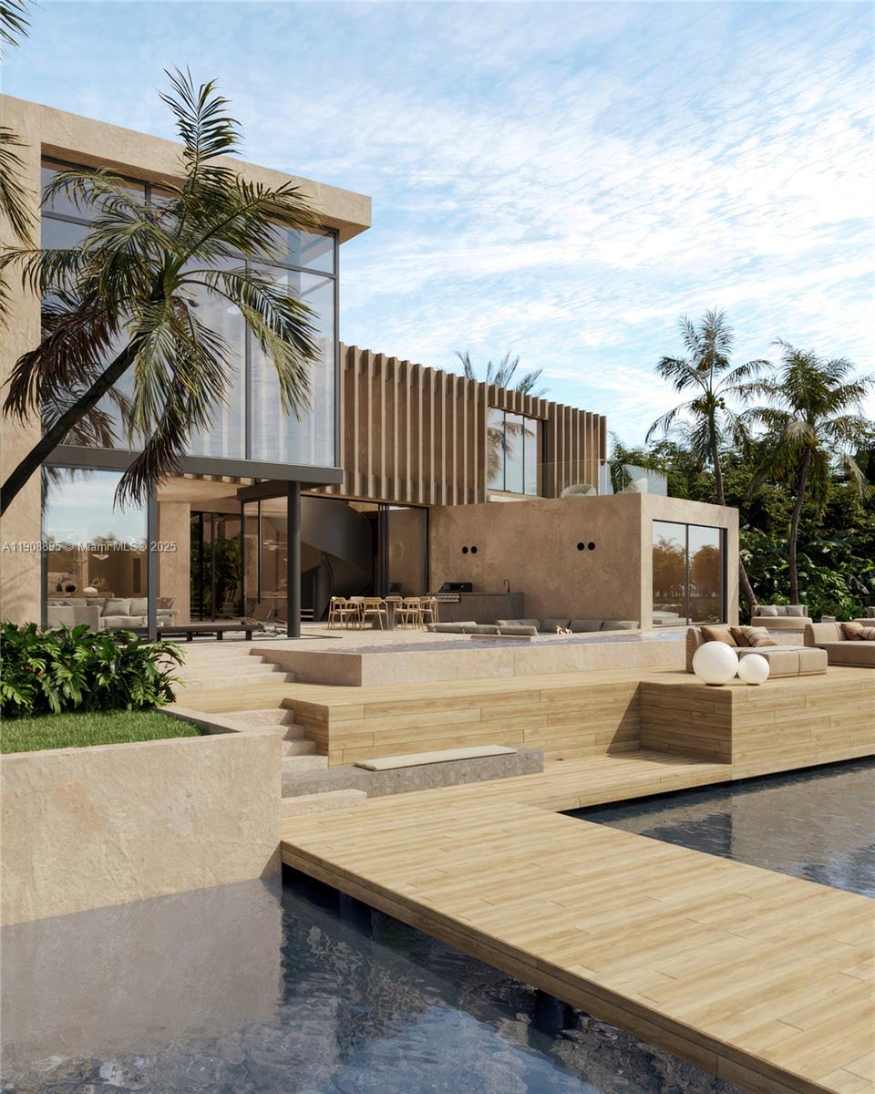 2010 Northeast 196th Terrace North Miami Beach, FL 33179 - Photo 12 of 26 a view of a house with swimming pool and sitting area