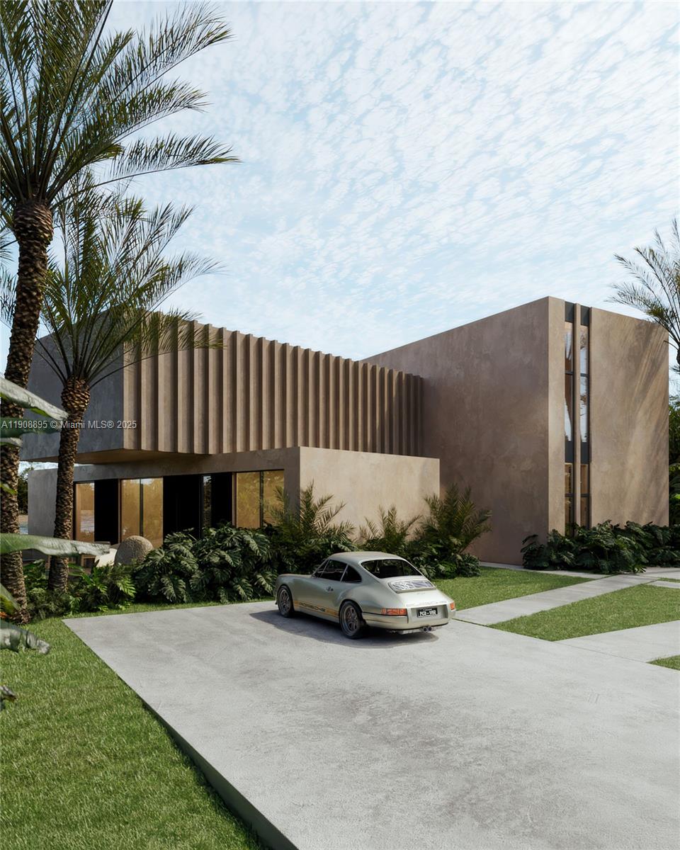 2010 Northeast 196th Terrace North Miami Beach, FL 33179 - Photo 3 of 26 a backyard of a house with table and chairs with plants and wooden fence