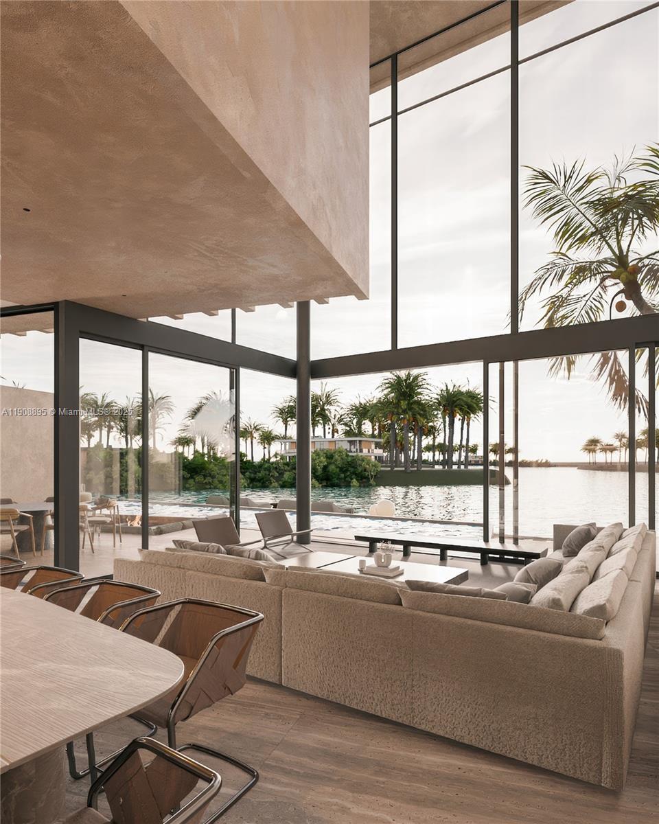 2010 Northeast 196th Terrace North Miami Beach, FL 33179 - Photo 5 of 26 a living room with furniture and a floor to ceiling window