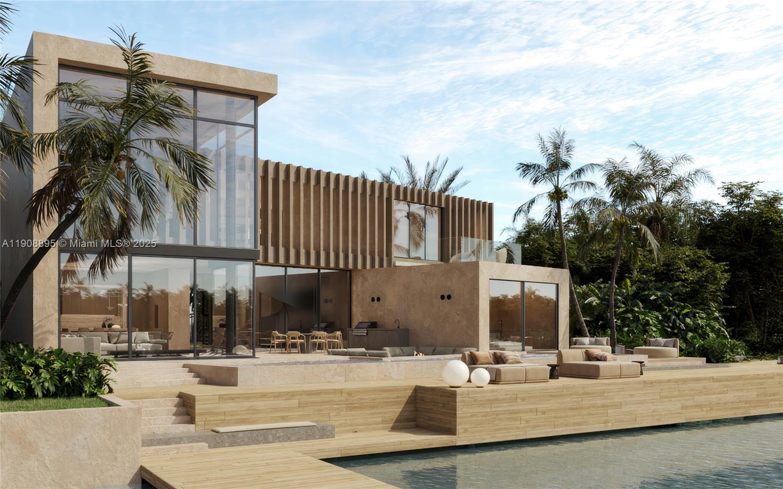 2010 Northeast 196th Terrace North Miami Beach, FL 33179 - Photo 6 of 26 a view of a patio with a table and chairs under an umbrella