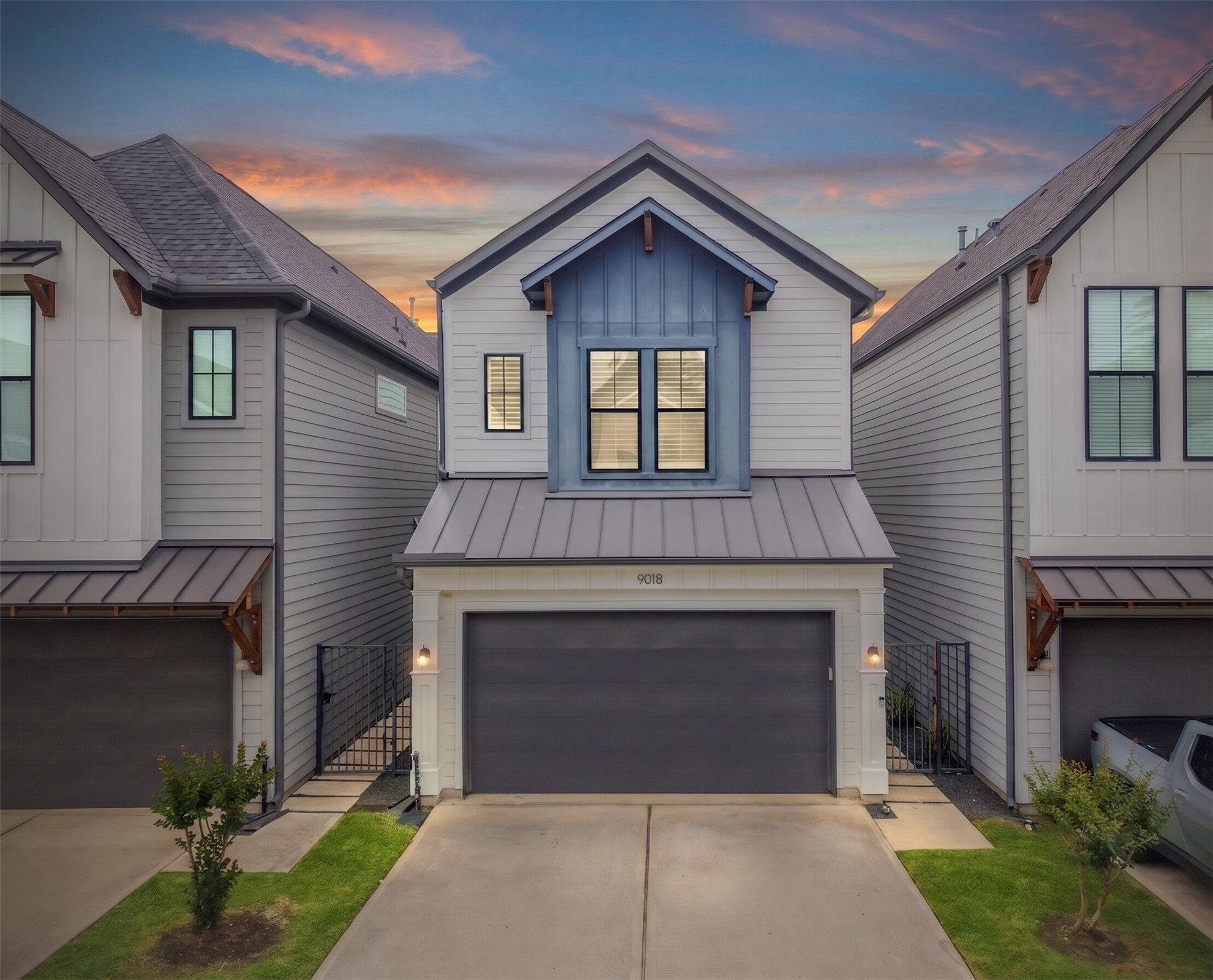 9018 Wellspring Drive Houston, TX 77080 - Photo 1 of 25 Sophisticated modern living awaits in this stunning 2020-built home, featuring a designer blue-accented gable, sleek metal roofing details, and an attached two-car garage located in the gated Laverne Springs community.