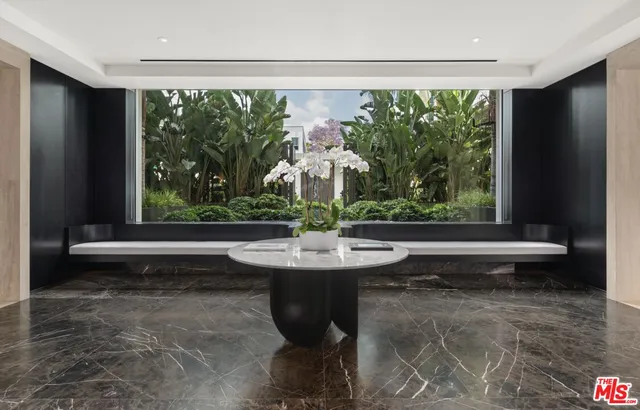 a dining room with a large window and table or chairs