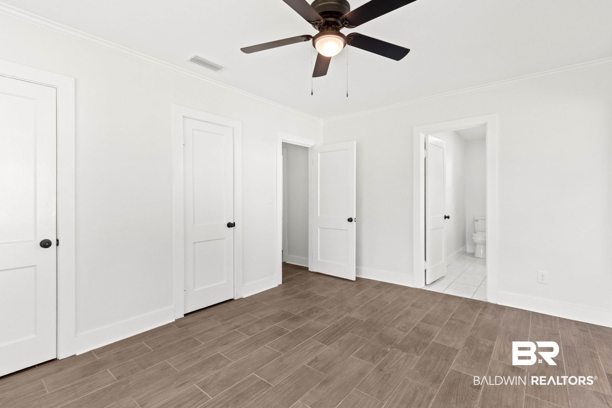 311 Cloverdale Road Atmore, AL 36502 - Photo 28 of 63 Room featuring wood-finish tile flooring and crisp white walls