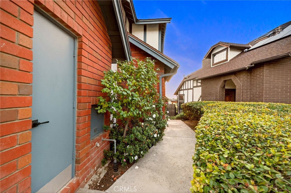 964 South Rim Crest Drive Anaheim, CA 92807 - Photo 11 of 69 a front view of a house with a yard
