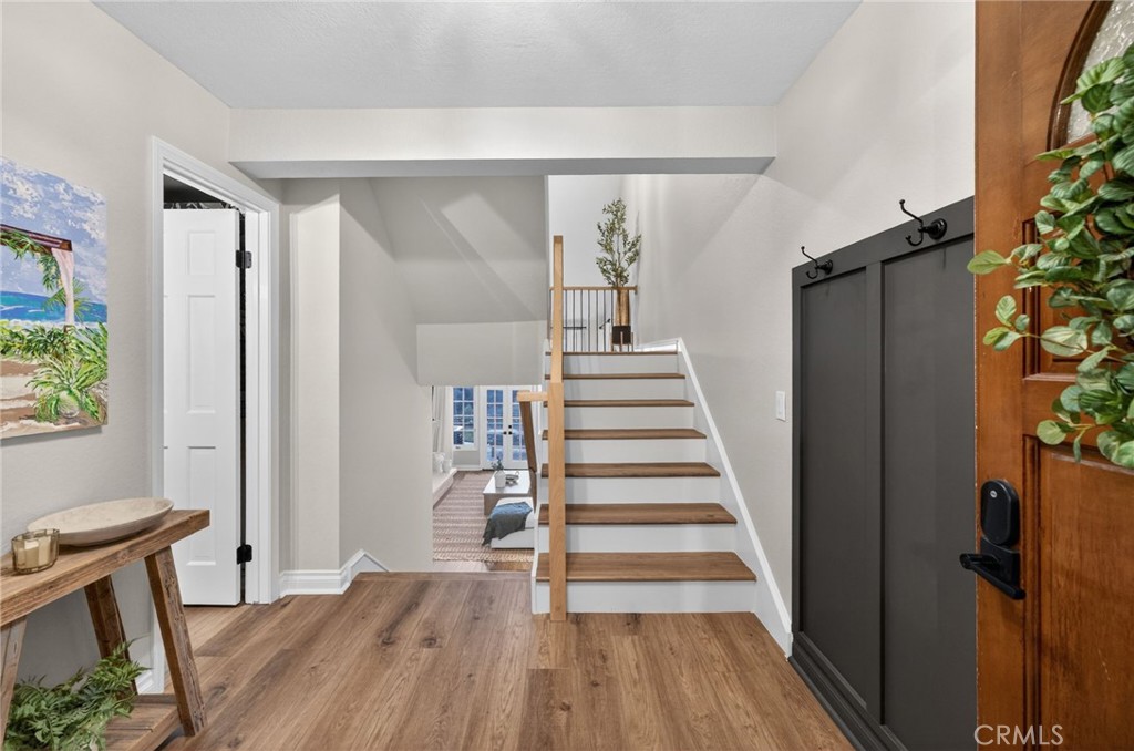 964 South Rim Crest Drive Anaheim, CA 92807 - Photo 12 of 69 a view of entryway with wooden floor and stairs