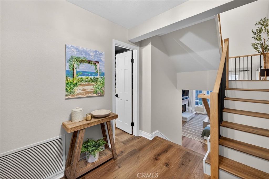 964 South Rim Crest Drive Anaheim, CA 92807 - Photo 13 of 69 a view of a hallway with wooden floor and furniture