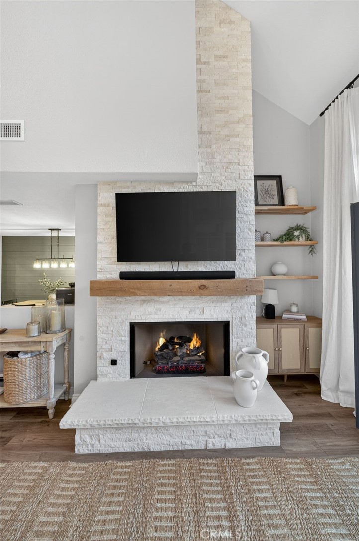 964 South Rim Crest Drive Anaheim, CA 92807 - Photo 16 of 69 a living room with furniture a fireplace and flat screen tv