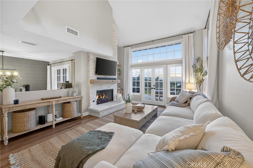 964 South Rim Crest Drive Anaheim, CA 92807 - Photo 21 of 69 a living room with furniture a fireplace and a flat screen tv