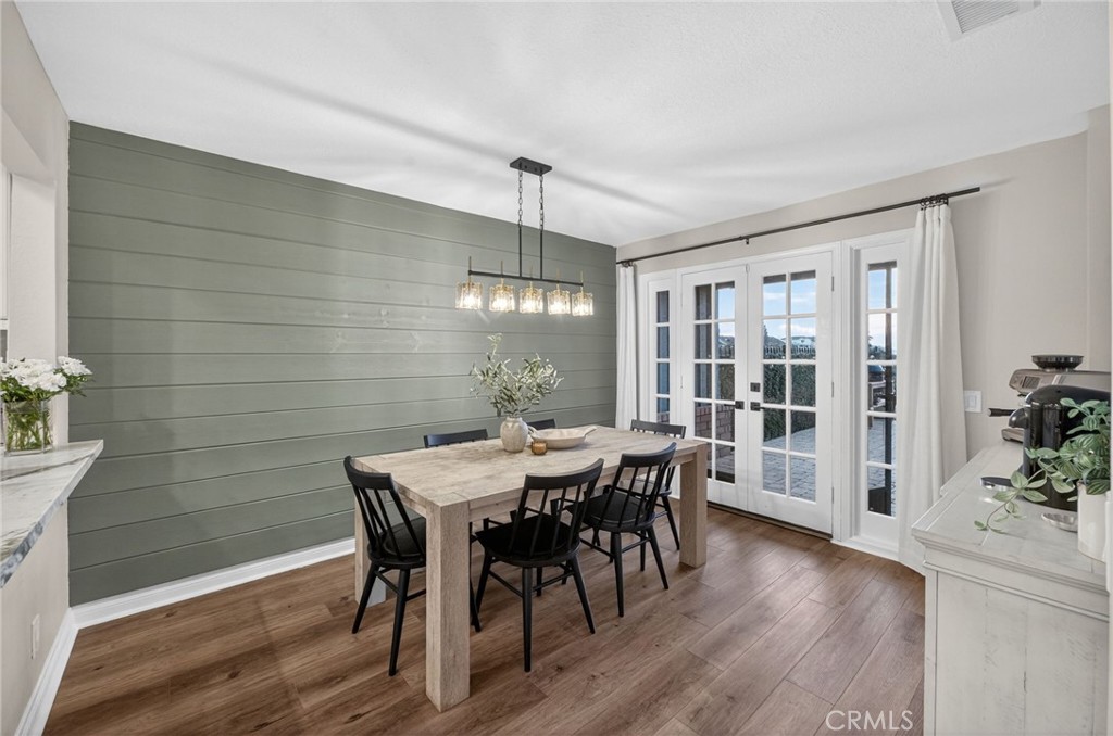 964 South Rim Crest Drive Anaheim, CA 92807 - Photo 22 of 69 a view of a dining room with furniture window and wooden floor