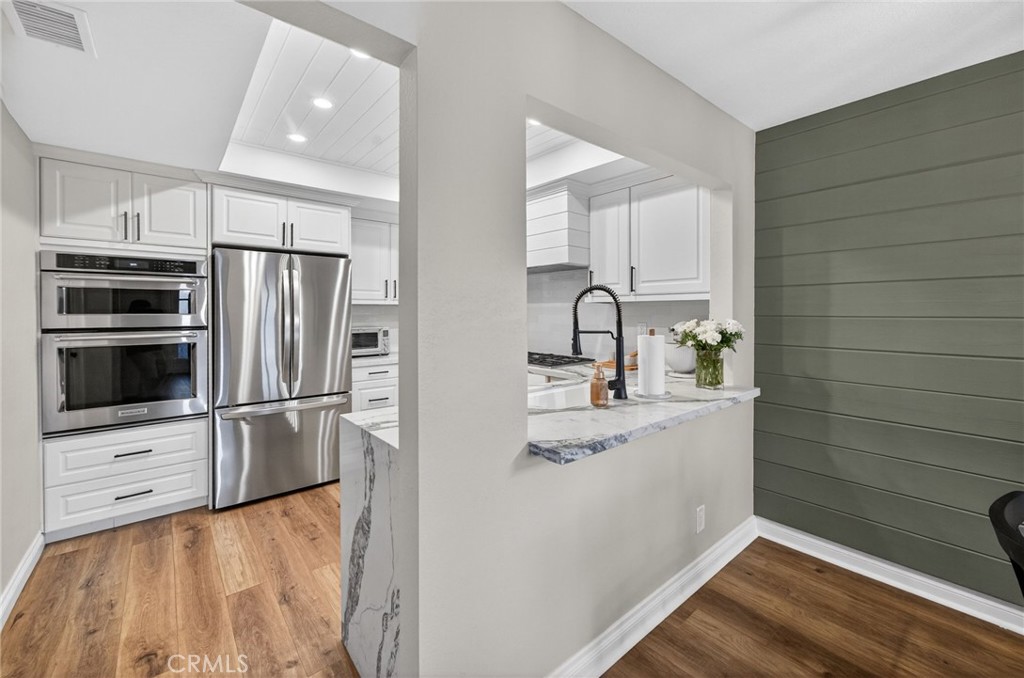 964 South Rim Crest Drive Anaheim, CA 92807 - Photo 25 of 69 a kitchen with stainless steel appliances a refrigerator sink and microwave