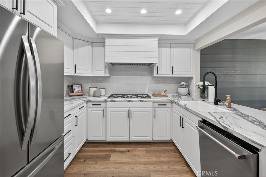 964 South Rim Crest Drive Anaheim, CA 92807 - Photo 26 of 69 a kitchen with a sink stove and refrigerator