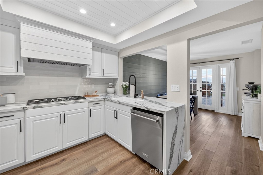 964 South Rim Crest Drive Anaheim, CA 92807 - Photo 27 of 69 a kitchen with a sink stove and cabinets