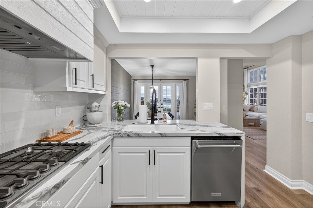 964 South Rim Crest Drive Anaheim, CA 92807 - Photo 28 of 69 a kitchen with granite countertop a sink stove and cabinets